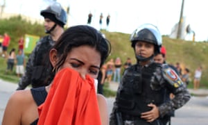 A relative of an inmate outside a prison in Amazonas.