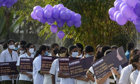 Medical students from Kamineni Hospitals hold placards as they take part in a rally to create awareness on women's health on International Women's Day in Hyderabad, India