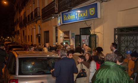 Homeless people and supporters of the charity behind the Robin Hood restaurant in Madrid gather for its launch on Tuesday.
