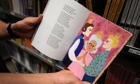 A bookshop employee in Torokbalint, Hungary, shows a page from Wondelrand is for Everyone.