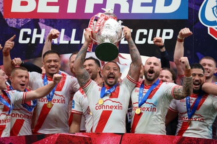 Hull KR’s Elliot Minchella (centre) celebrates with the trophy after the victory over Warrington.