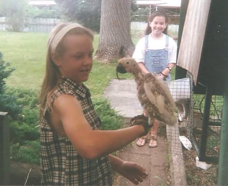 Hannah Parslow with Doug after his feather loss. A disgusted school friend, who refused to be within three metres of the creature from hell, looks on.