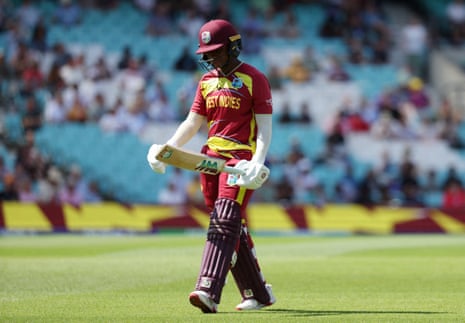 Jahzara Claxton walks back to the pavilion after losing her wicket.