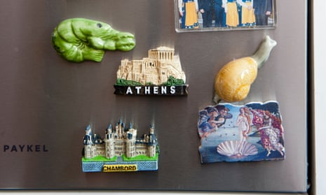 Several fridge magnet on a fridge including one for Athens