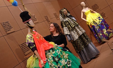 A design by Matty Bovan is adjusted byElise Foster Vander Elst, the head of exhibitions at London’s Design Museum, at the Rebel: 30 Years of London Fashion show.