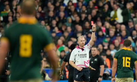 Wayne Barnes holds up a red card