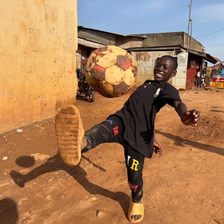 Boy playing with a football