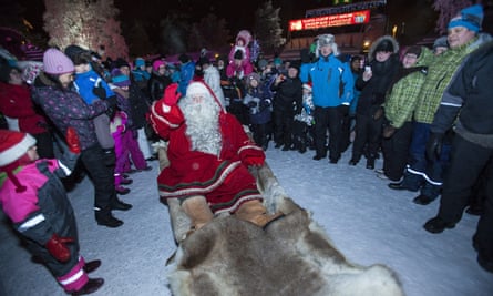 Crowds gather round Santa Claus in Rovaniemi.