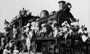 Muslim refugees cram aboard a train during the partition conflict in 1947 ... the railways were first conceived by the East India Company for its own benefit. Photograph: AP