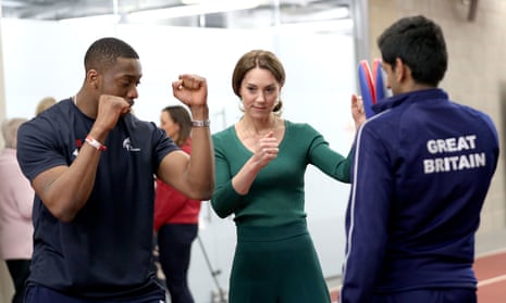 Lutalo Muhammad (left) demonstrating taekwondo to the Duchess of Cambridge during a SportsAid event at the London Stadium in Stratford.
