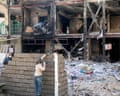 Workers in Tehran at the site of a damaged residential building that, according to Iranian authorities, was hit by a strike on 4 March 4 during the US-Israeli military campaign.