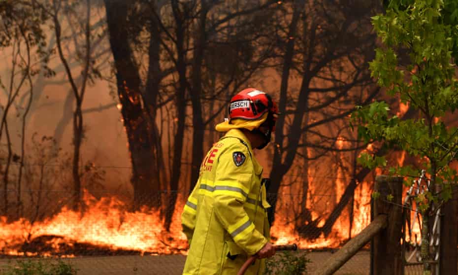 A firefighter works to contain a fire near Bilpin, NSW