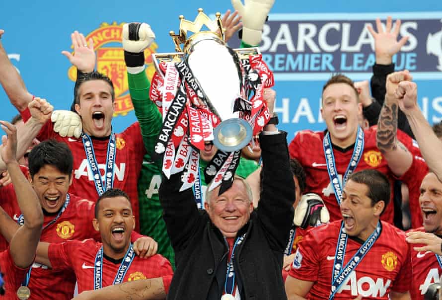 Sir Alex Ferguson lifts the Premier League trophy in 2013 – his final act as manager of Manchester United
