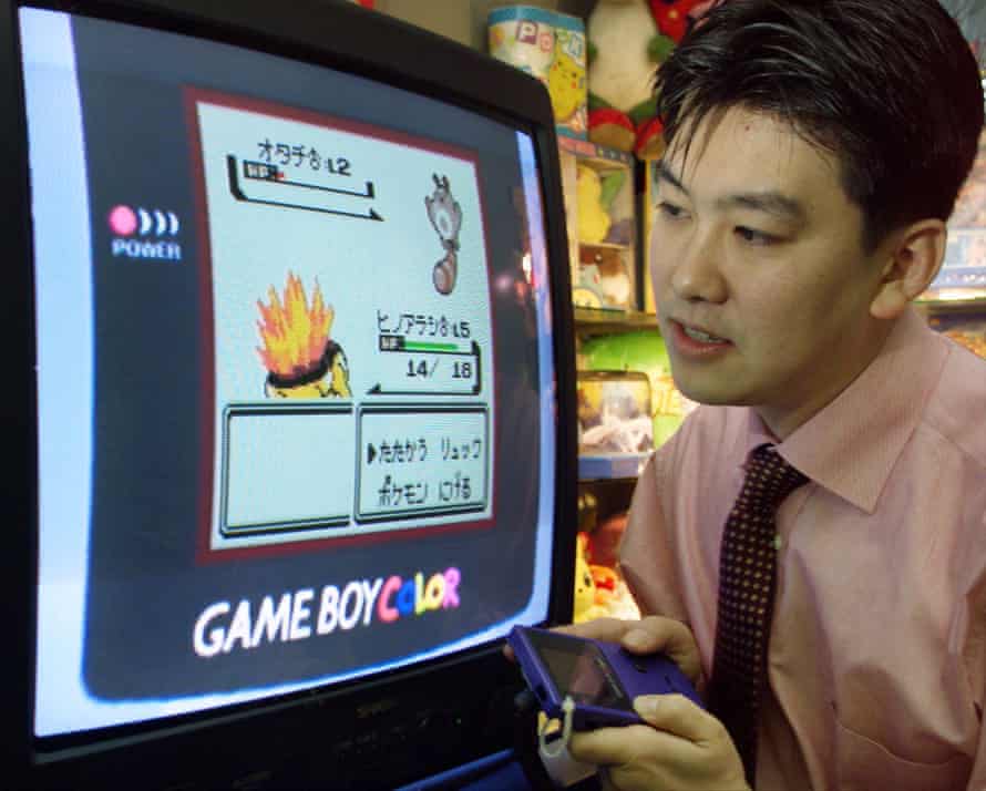 A Nintendo sales representative demonstrates Pokemon in 1999.