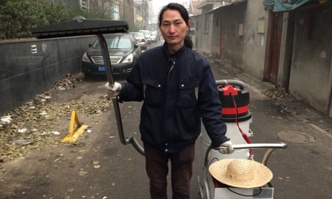 Wang Renzheng, a Chinese artist better known as Nut Brother, and the industrial vacuum cleaner he uses to suck up smog. 