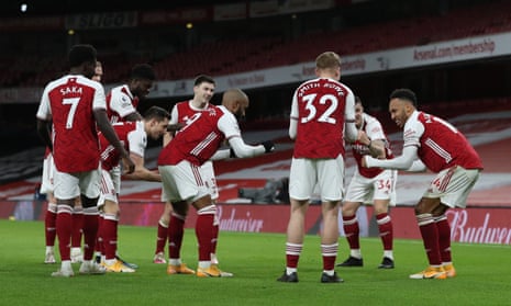Arsenal celebrate in the socially distanced style.