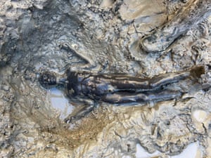 San Casciano dei Bagni, Italy. A bronze statue emerges from the mud, one of 24 discovered during excavations in Tuscany and believed to be 2,300 years old