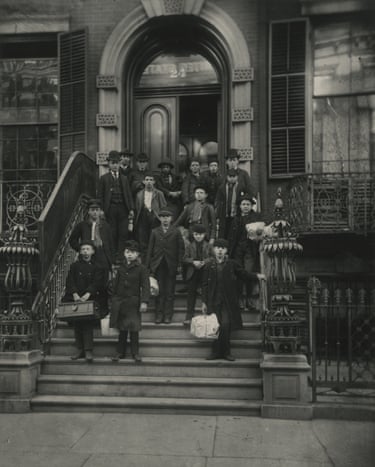 young boys on steps in front of a brownstone