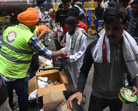 Volunteers distribute food