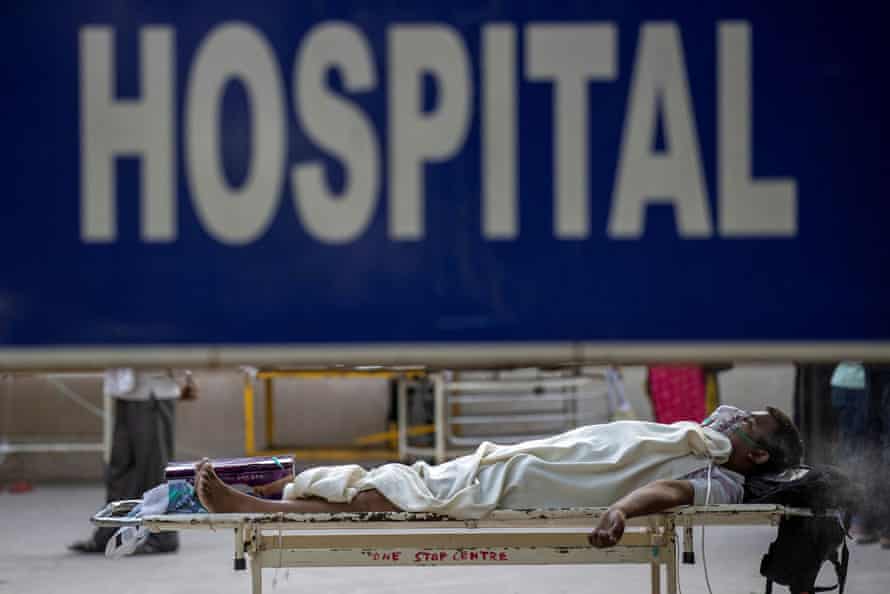 A Covid patient waits outside a hospital in Delhi, April 2021.