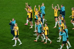 Australia’s players celebrate reaching the World Cup quarter-finals.