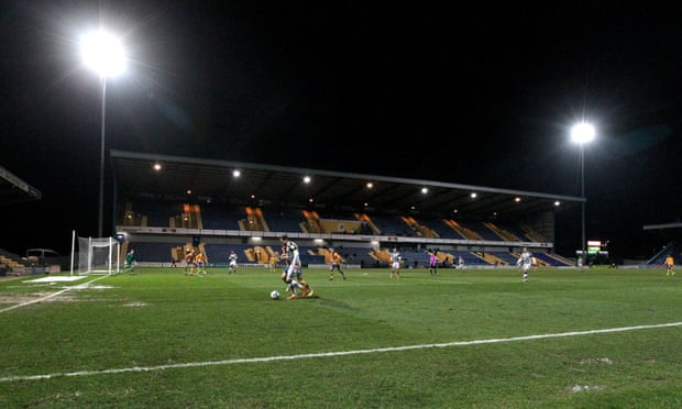 Action under the floodlights at Mansfield in March 2021.
