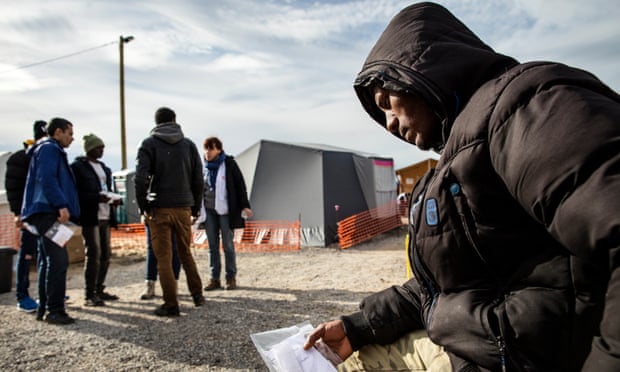 An Eritrean refugee waits for medical attention in ‘the Jungle’ camp in Calais. 