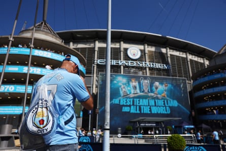 A Manchester City fan outside the Etihad Stadium.