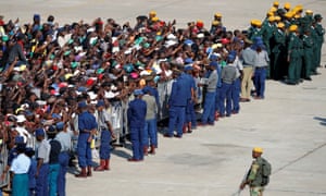 Mourners at the airport in Harare.