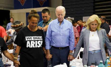 Joe Biden and Jill Biden pray as they attend a community event at the Lahaina civic center.