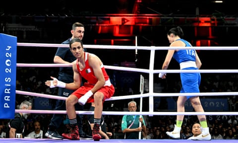 Angela Carini leaves the ring after abandoning the bout.