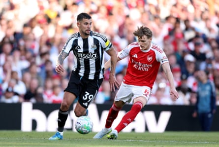 Bruno Guimarães playing against Martin Ødegaard.