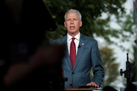 a man in a suit speaking