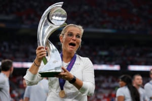 England’s manager Sarina Wiegman celebrates with the trophy – hr second Euro title in a row.