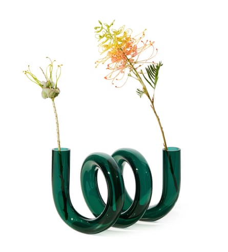 a spiral-shaped vase with flowers