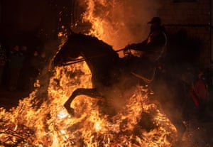 Flames engulf a horse and rider