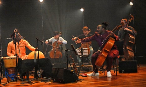 Abel Selaocoe, right, with percussionist Mohamed Gueye (left) and members of Manchester Collective at the Queen Elizabeth Hall.