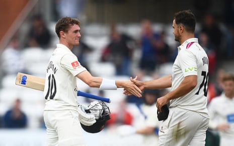 George Balderson is congratulated by Somerset’s Jack Brooks.