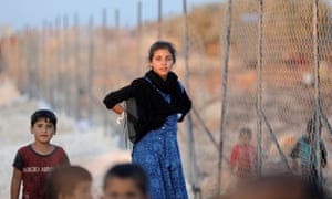 Newly displaced Syrian children arrive to a refugee camp in Atimah village, Idlib province on 11 September 2018. 3500.jpg?width=300&quality=85&auto=forma