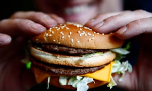 Person holding burger