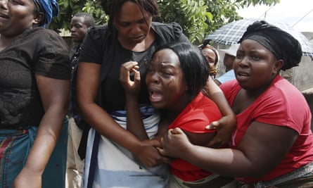A family member reacts during the funeral of Kelvin Tinashe Choto