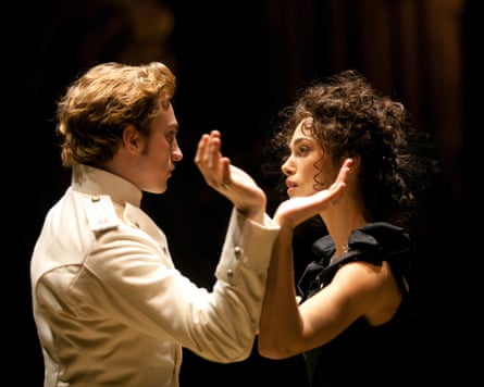 Keira Knightley and Aaron Taylor-Johnson looking at each other in Anna Karenina