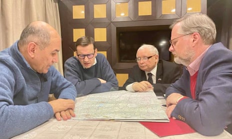 From left to right: Janez Janša, Mateusz Morawiecki; Poland’s deputy PM, Jarosław Kaczyński, and Petr Fiala study a map of Ukraine in a wood-panelled room in an undisclosed location in Kyiv.