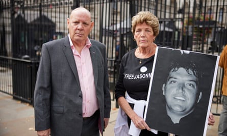 Tim Darby, the brother of Robert Darby, with Jenny Moore, Jason Moore’s mother, protest outside Downing Street