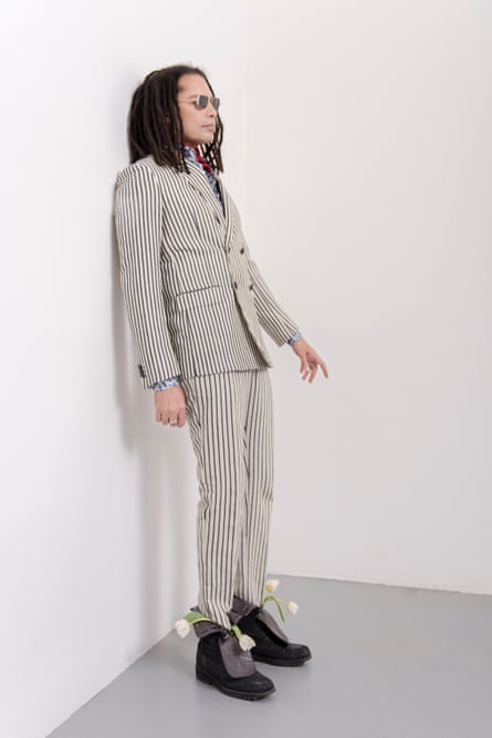Sananda Maitreya wears a striped suit and odd boots.