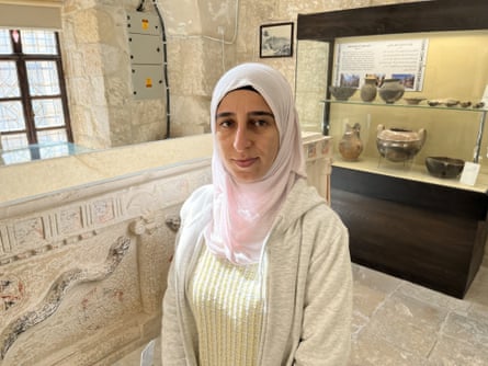 Wala’a Ghazal in front of museum exhibitions