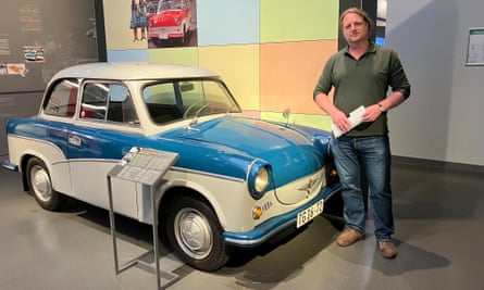 Curator Randy Kämpf stands next to communist East Germany's Trabant car at the August Horch Museum, which traces Zwickau’s history in the automobile industry.