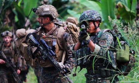 US and Filipino soldiers during a jungle survival drill. China has warned against flexing of ‘gunboat muscles’ as the Philippines and US begin military drills.