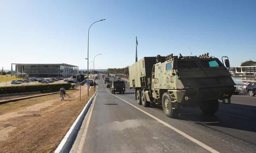 A military convoy parades in front of the Esplanada do Ministerios, in Brasília, Brazil.