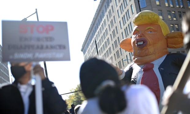 Protesters carry an effigy of US President Donald Trump as they demand that every vote be counted during a rally in Washington DC.